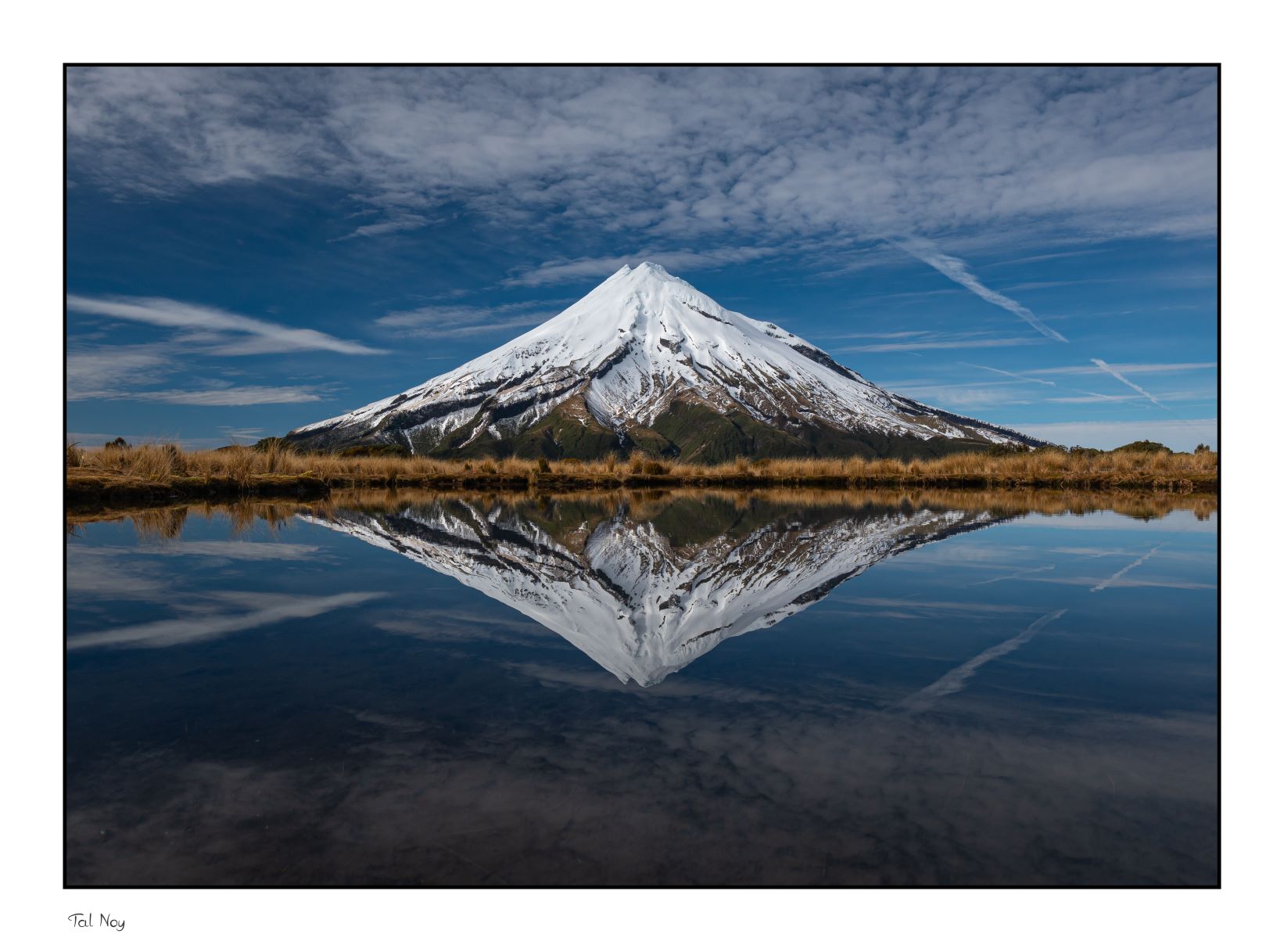 Perfect Reflection - mirror-like lake reflecting snow-capped mountains